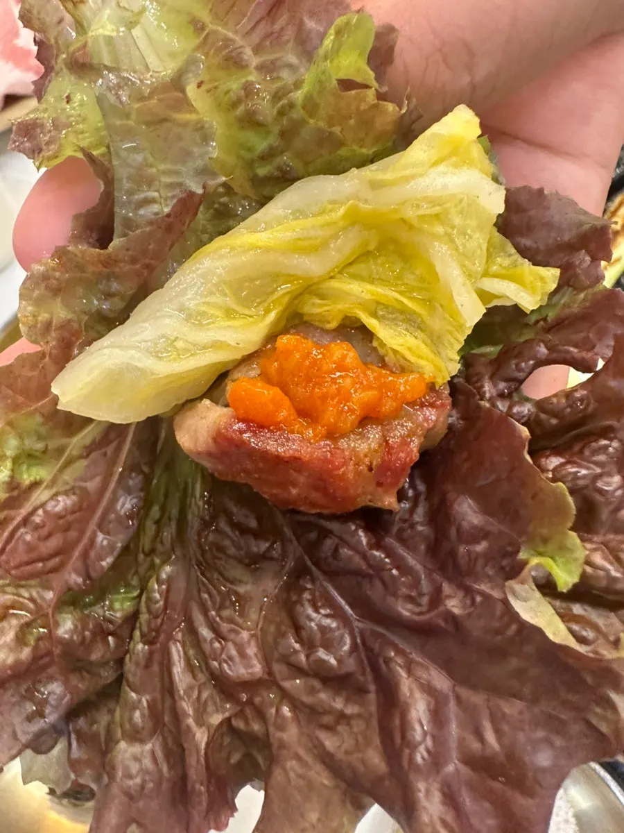 A piece of pork dipped in salt