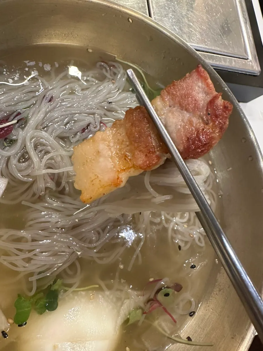 Cold naengmyeon topped with radish and egg