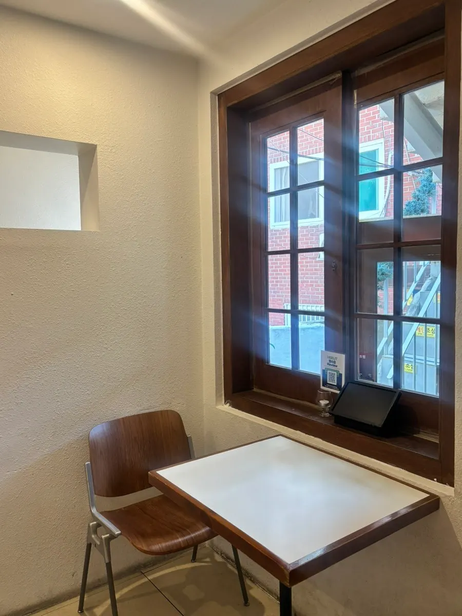 Interior space with group seating at Huirit