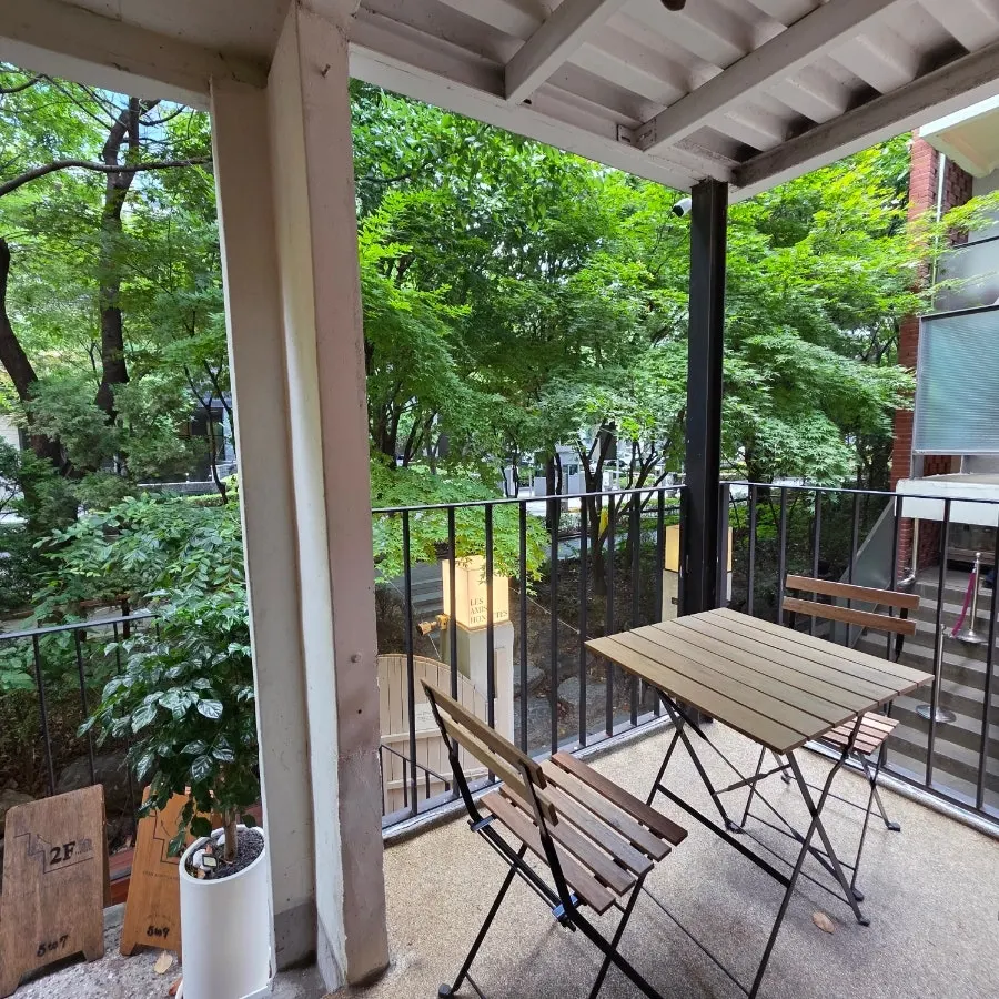 Outdoor terrace seats with a Seoul Forest view