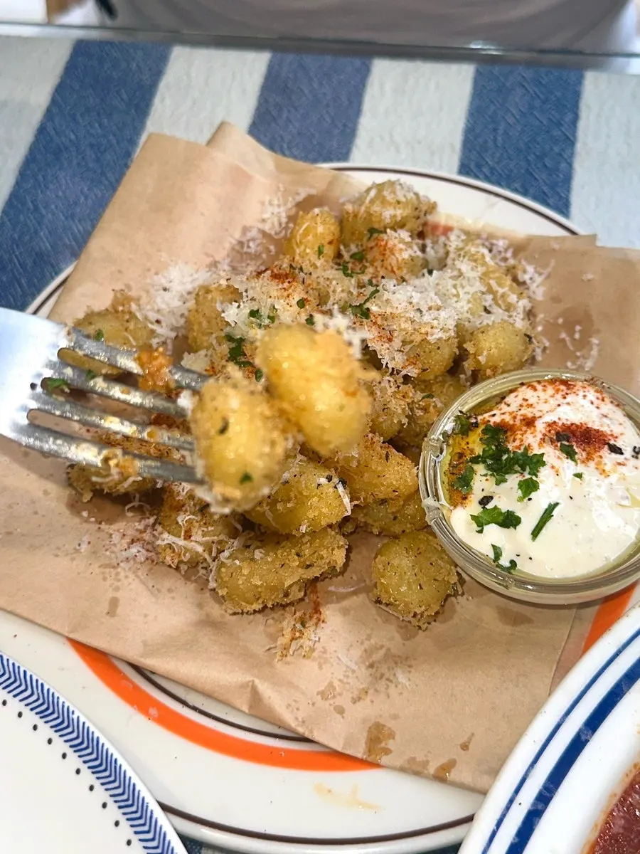 Gnocchi fritti dipped in aioli sauce