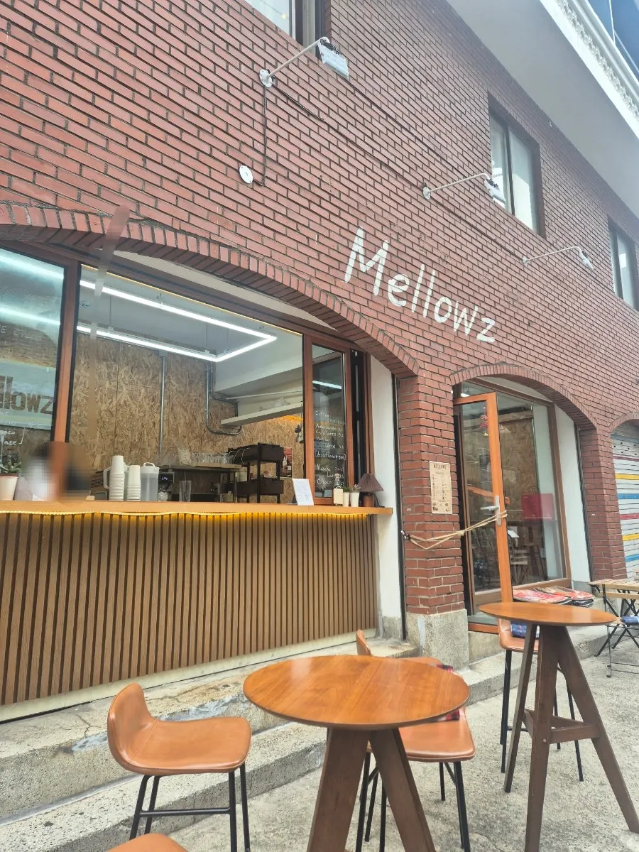 Café exterior on the first floor of a brick building