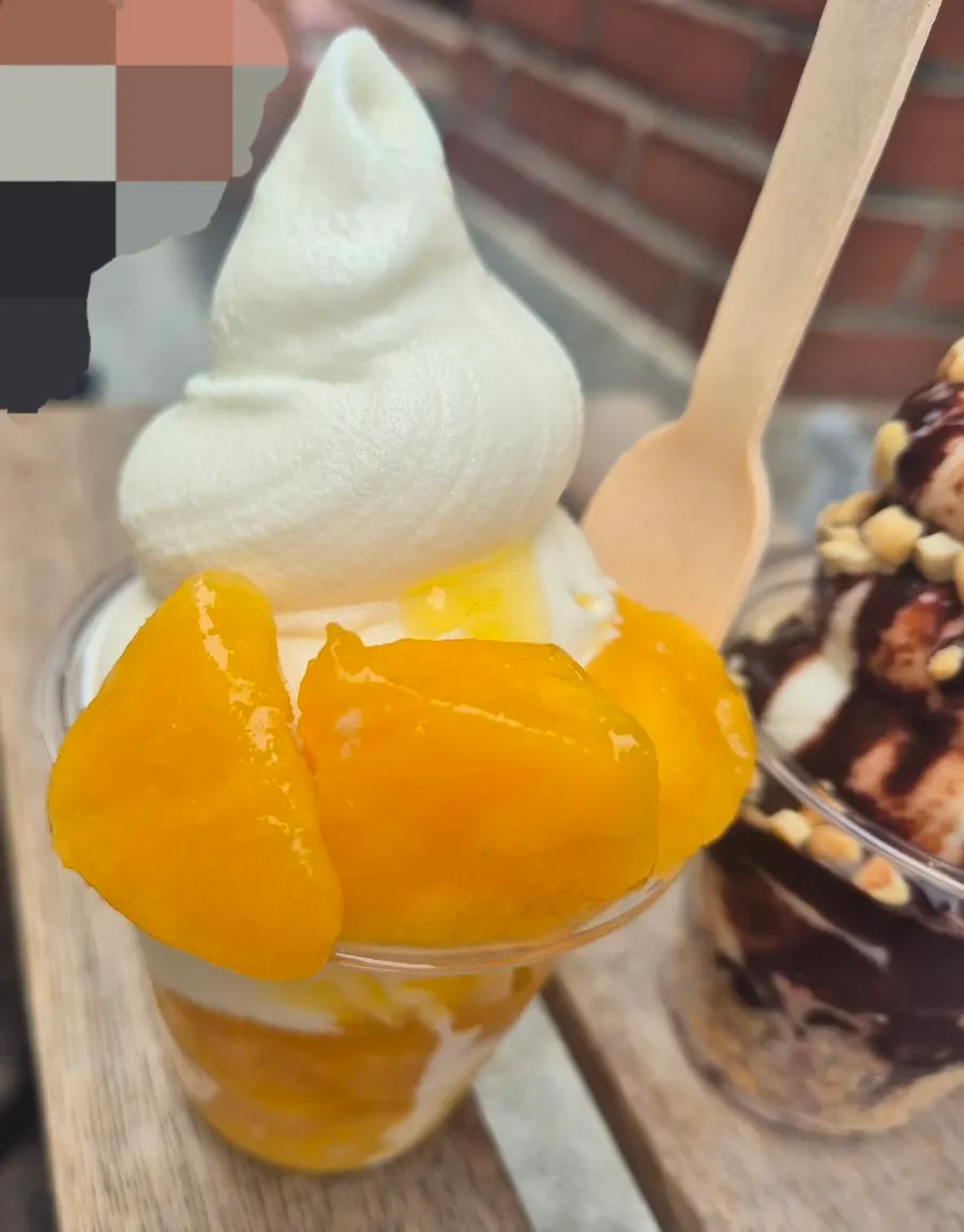 Ice cream dessert topped with mango