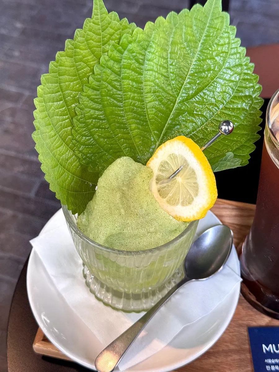 Smoothie topped with perilla leaf and lemon