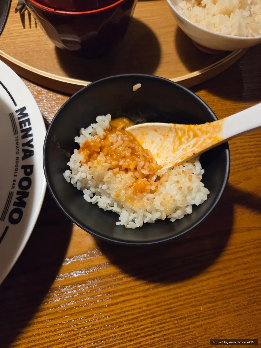 Full spread of ordered tomato ramen dishes
