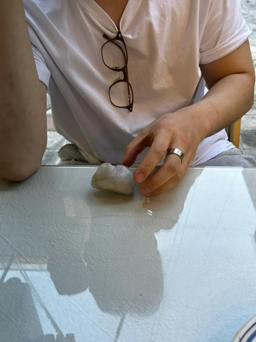 A table with shell decor and QR menu ordering