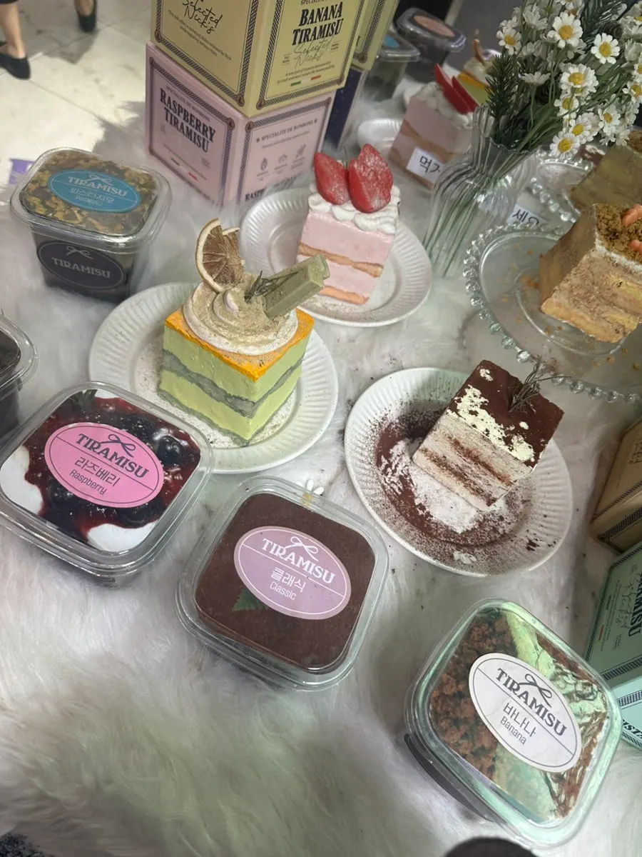 Dessert display case with tiramisu and crumble desserts