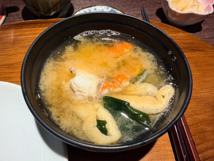Seafood miso soup with a whole blue crab