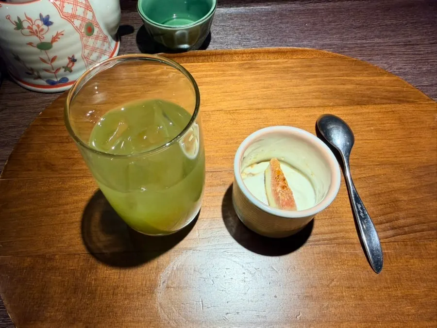 Green tea served alongside dessert
