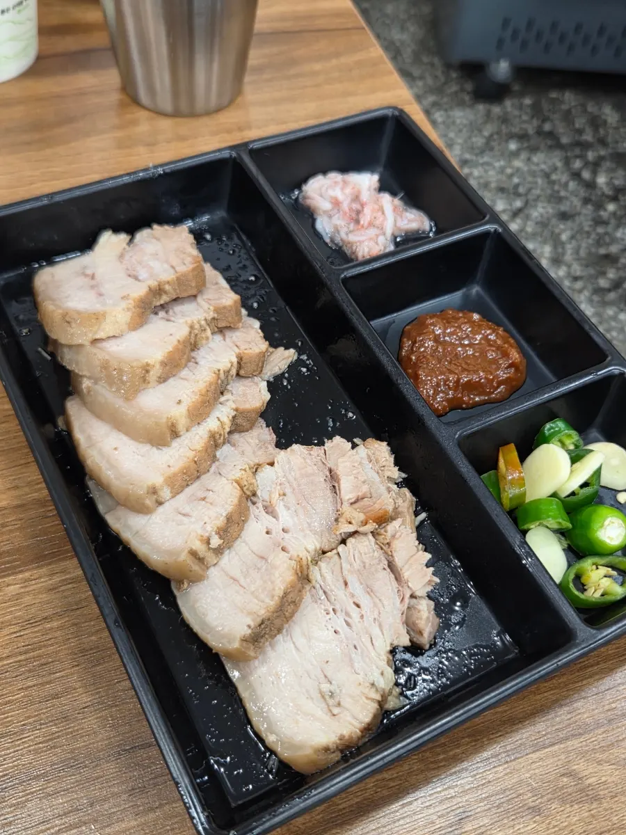 Half plate of domestic pork belly suyuk with side dishes