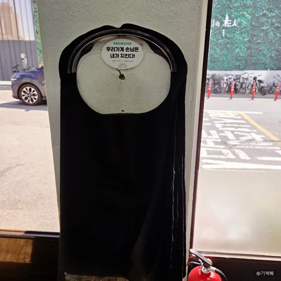 Disposable aprons set out at Seoul Myeonok's entrance