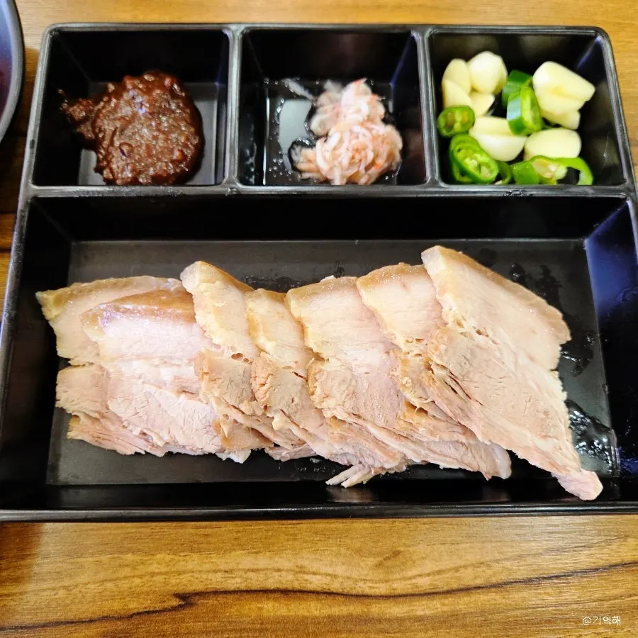 Salted shrimp, ssamjang, chili, and garlic served with boiled pork