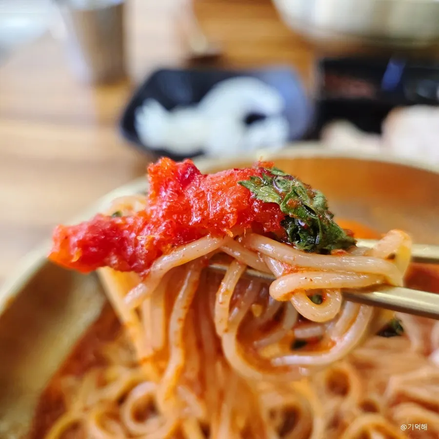 Skate sashimi salad served alongside bibim naengmyeon