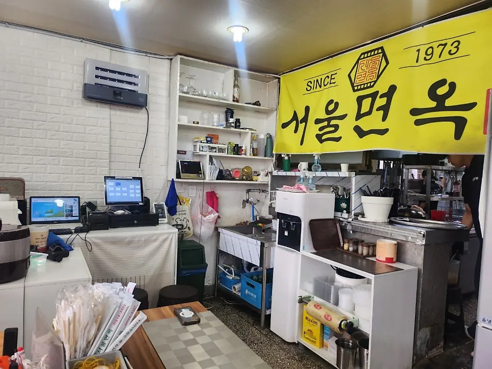A cup of warm broth at Seoul Myeonok