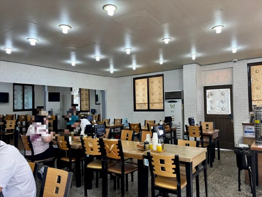 Interior of Seoul Myeonok with several tables