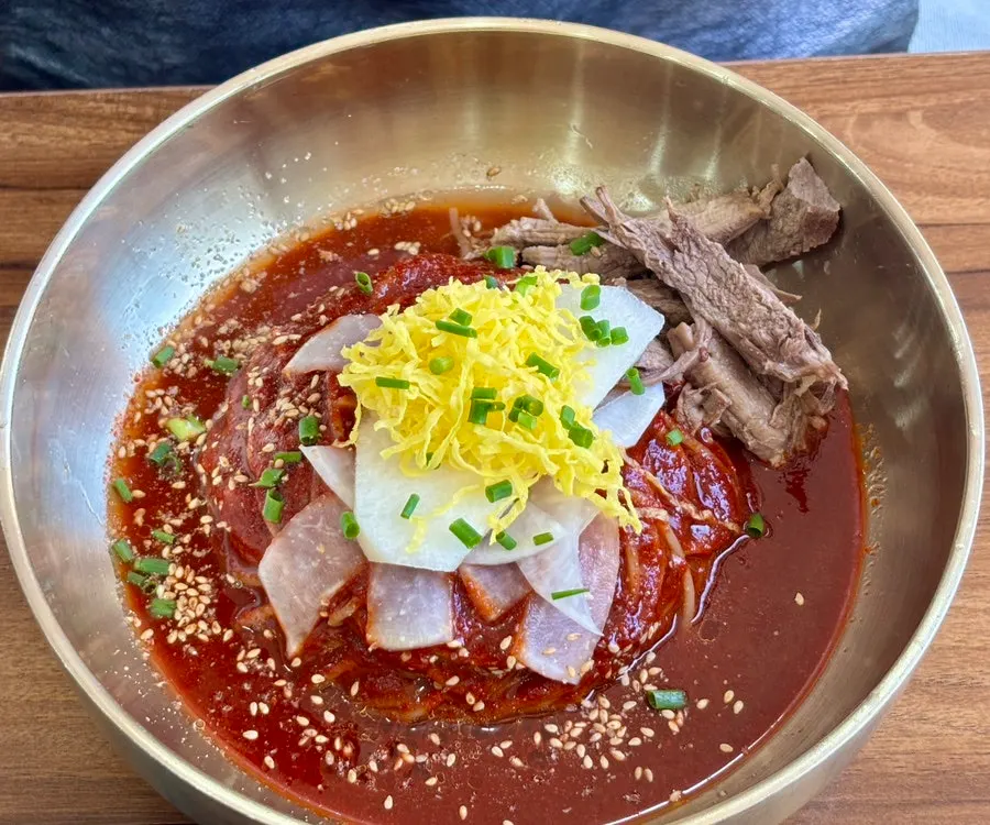 Seoul Myeonok's bibim naengmyeon topped with red sauce