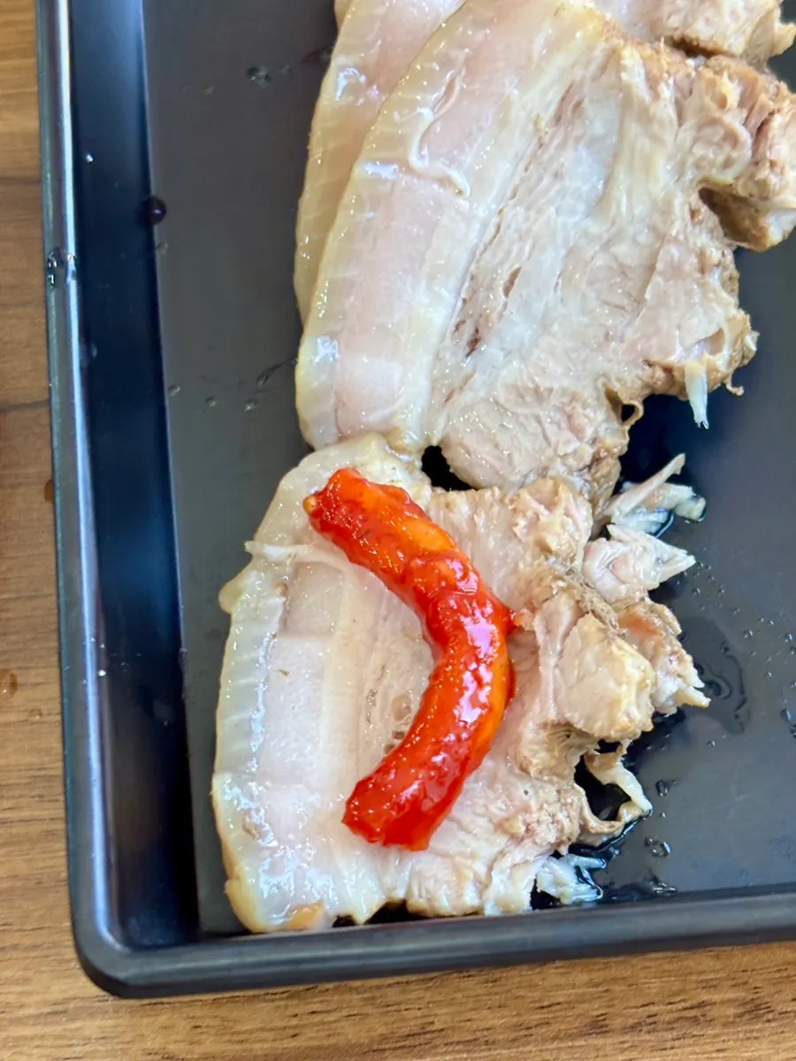 A piece of pork belly boiled meat eaten with salted shrimp