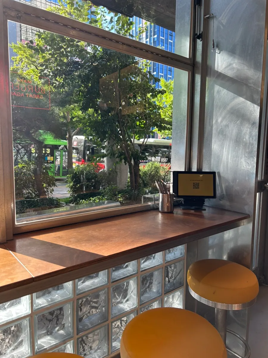 Interior with bar table and 2–4 person tables