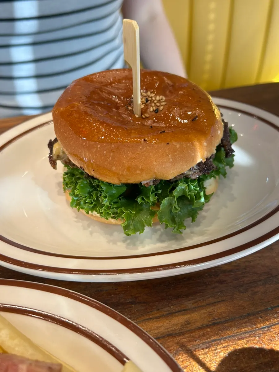 Cross-section of a bitten Bacon Cheese Burger