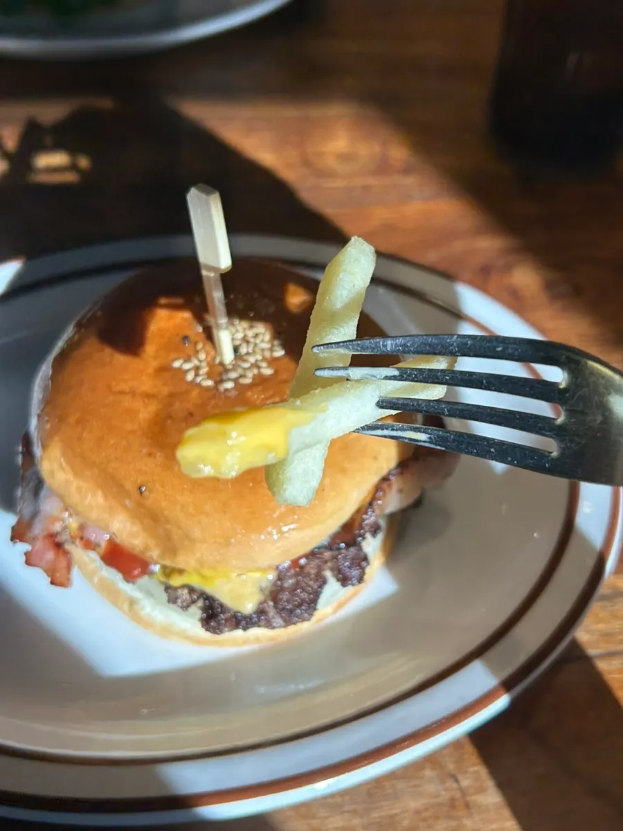 Both burgers and a side dish arranged on the table