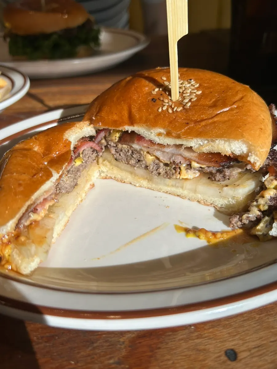 Cross-section of a burger packed with ingredients