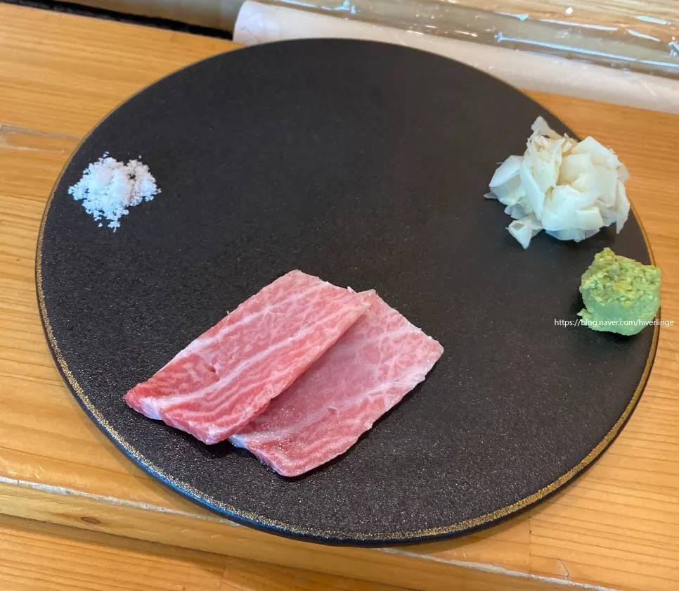 Two pieces of tuna otoro sashimi
