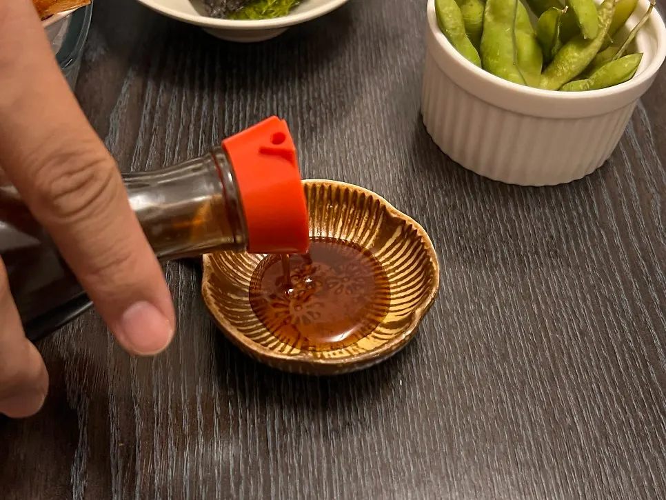 Sashimi soy sauce and accompaniments at Tomo
