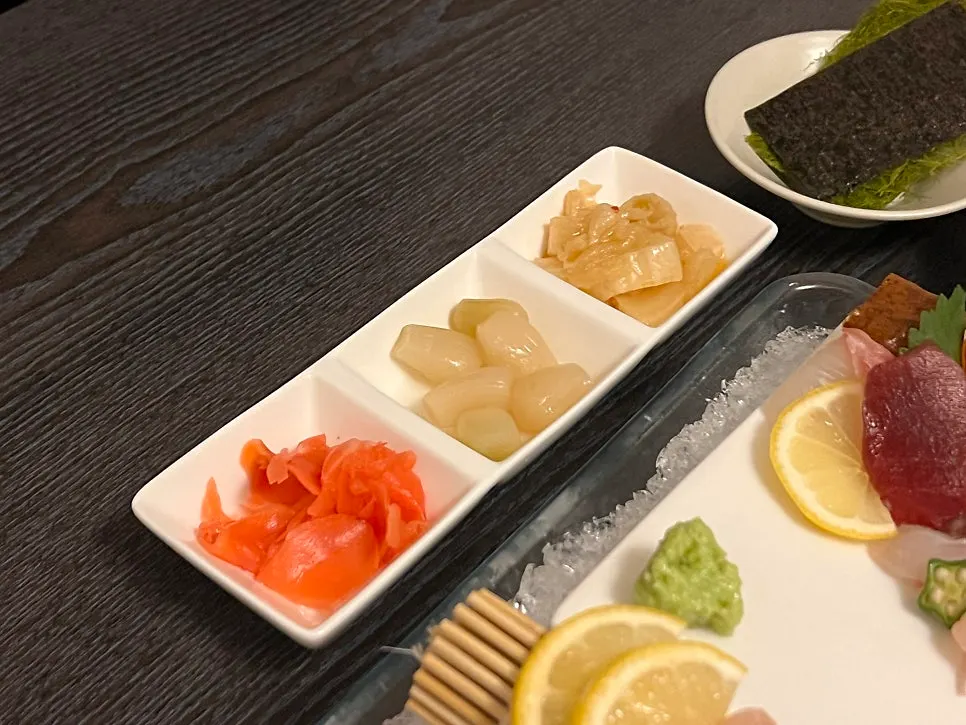 Side dishes including aged kimchi and pickled radish