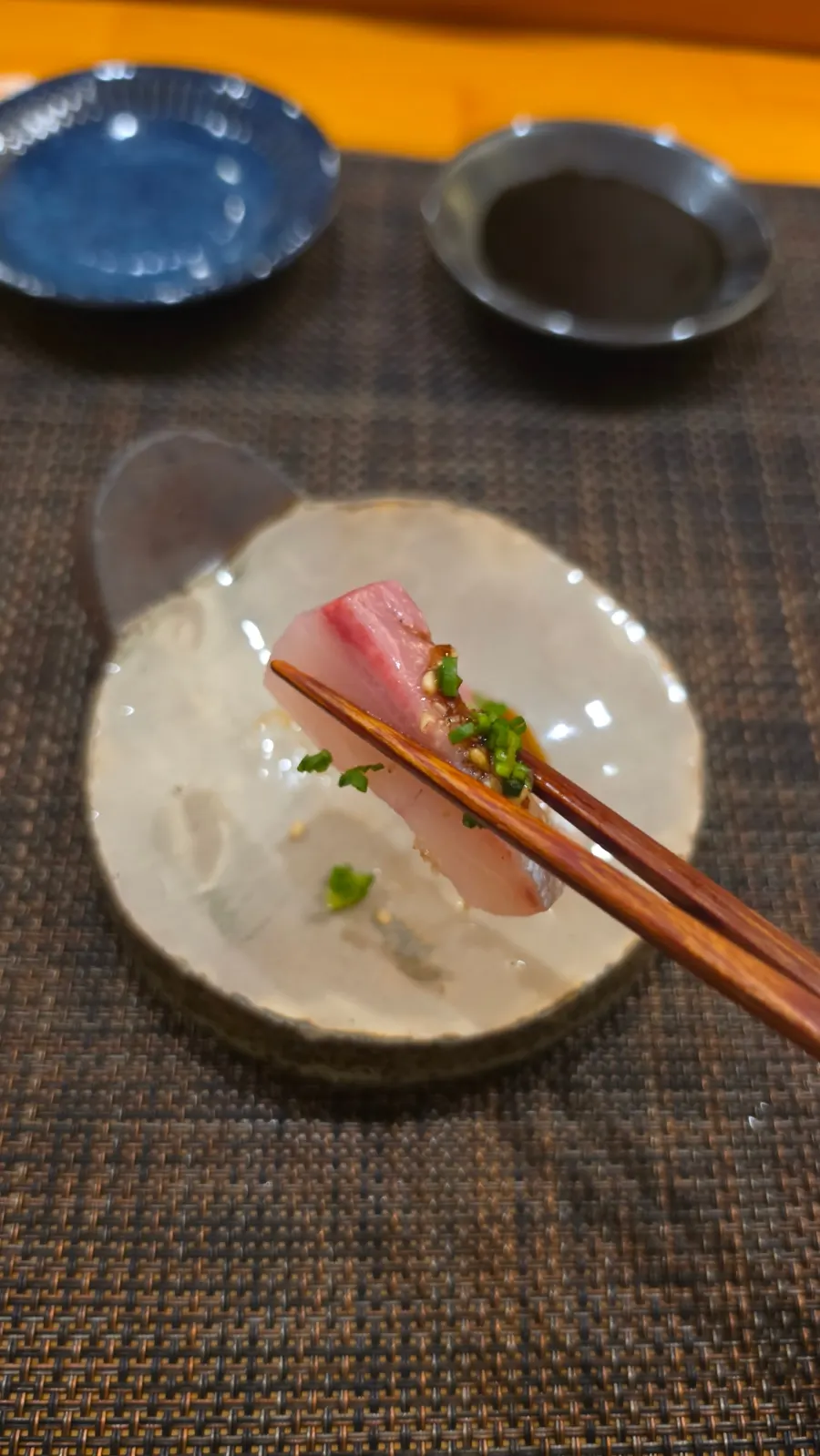 Amberjack sashimi topped with sauce