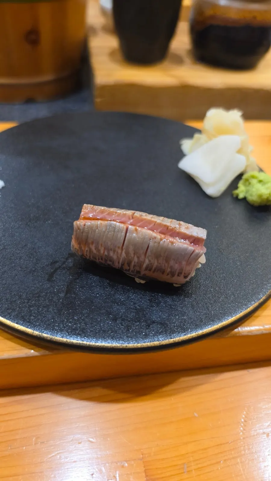 Tuna belly sushi topped with wasabi