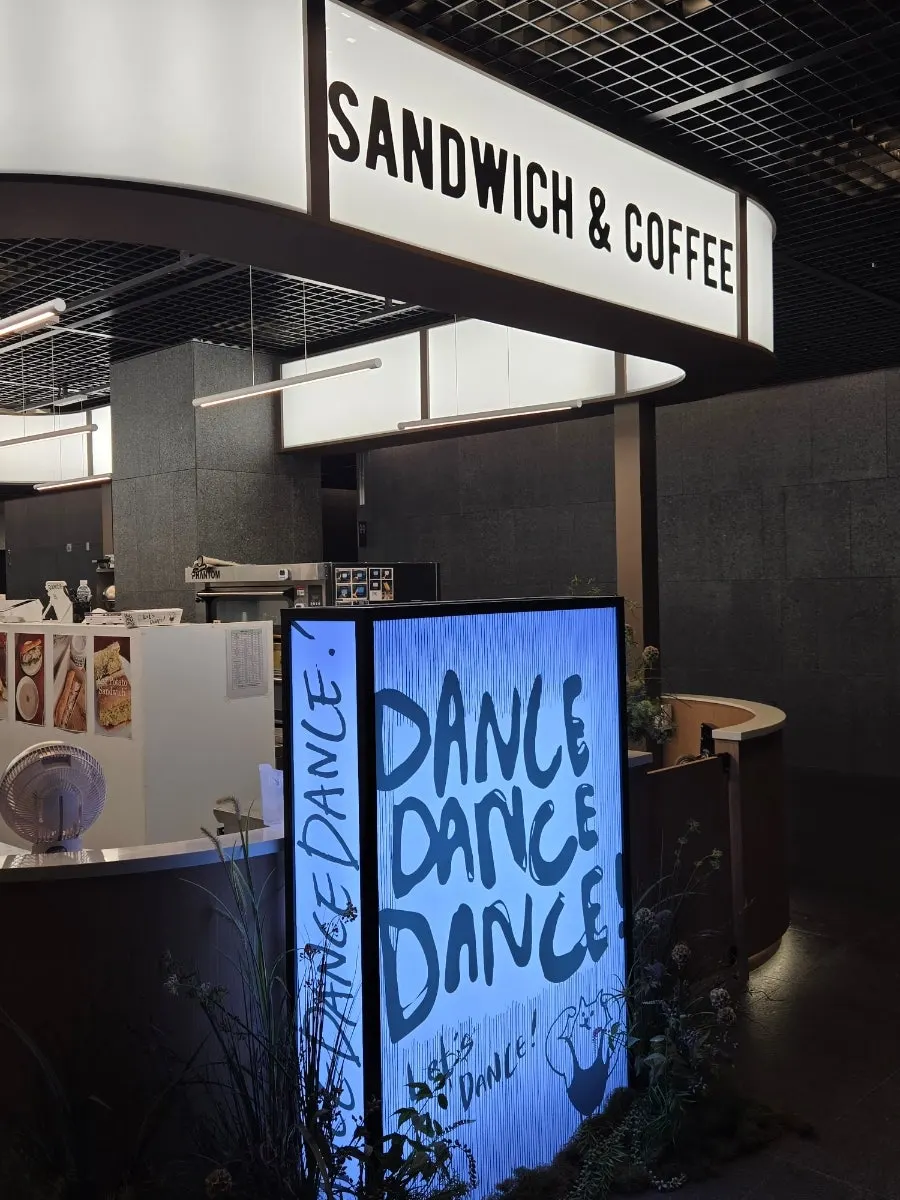 Seating area with tables and chairs at Dance Dance Dance Seoul Station