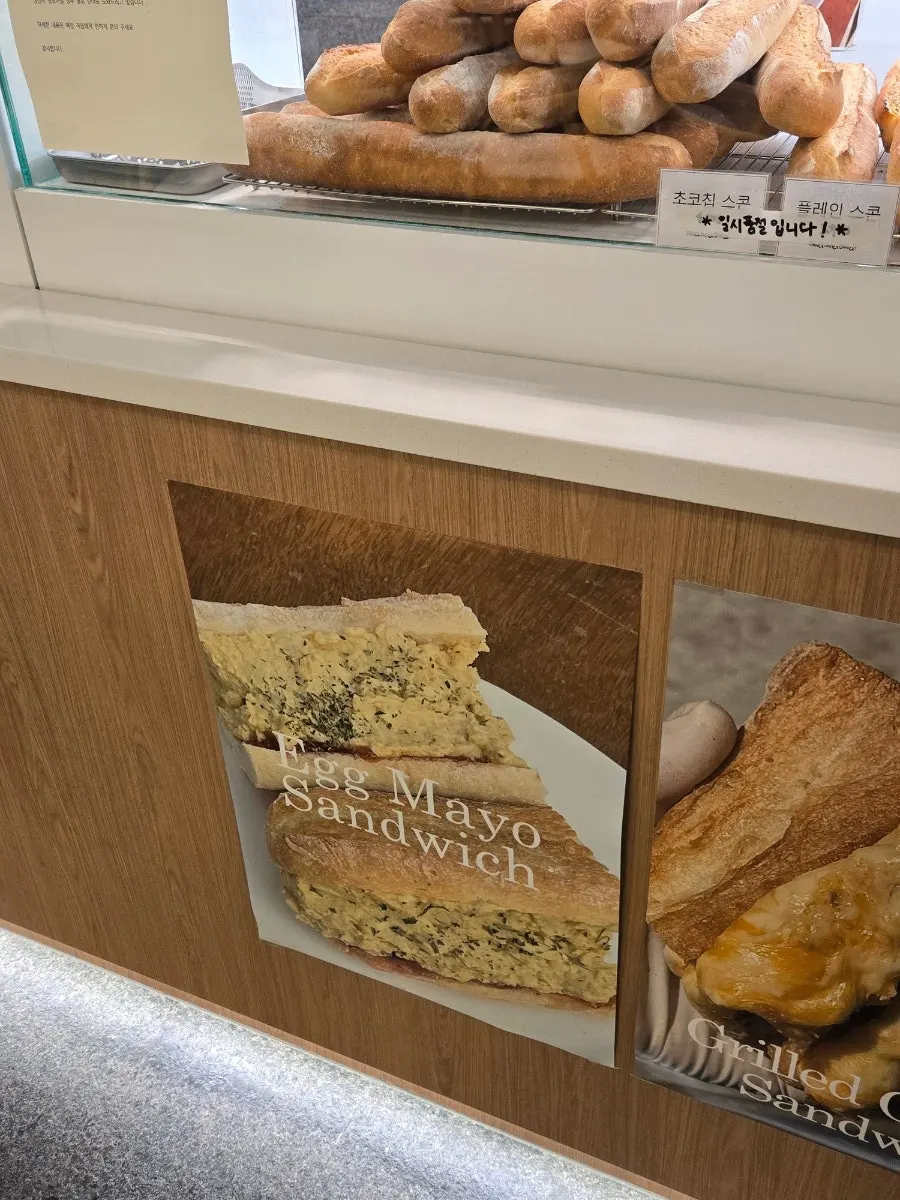 Egg mayo sandwich and other bakery items on display