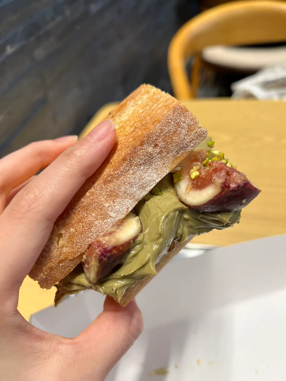 Fig pistachio baguette with a bite taken out