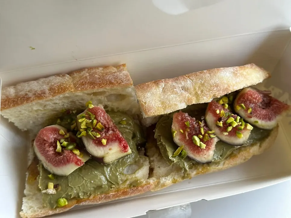 Unwrapped fig pistachio baguette