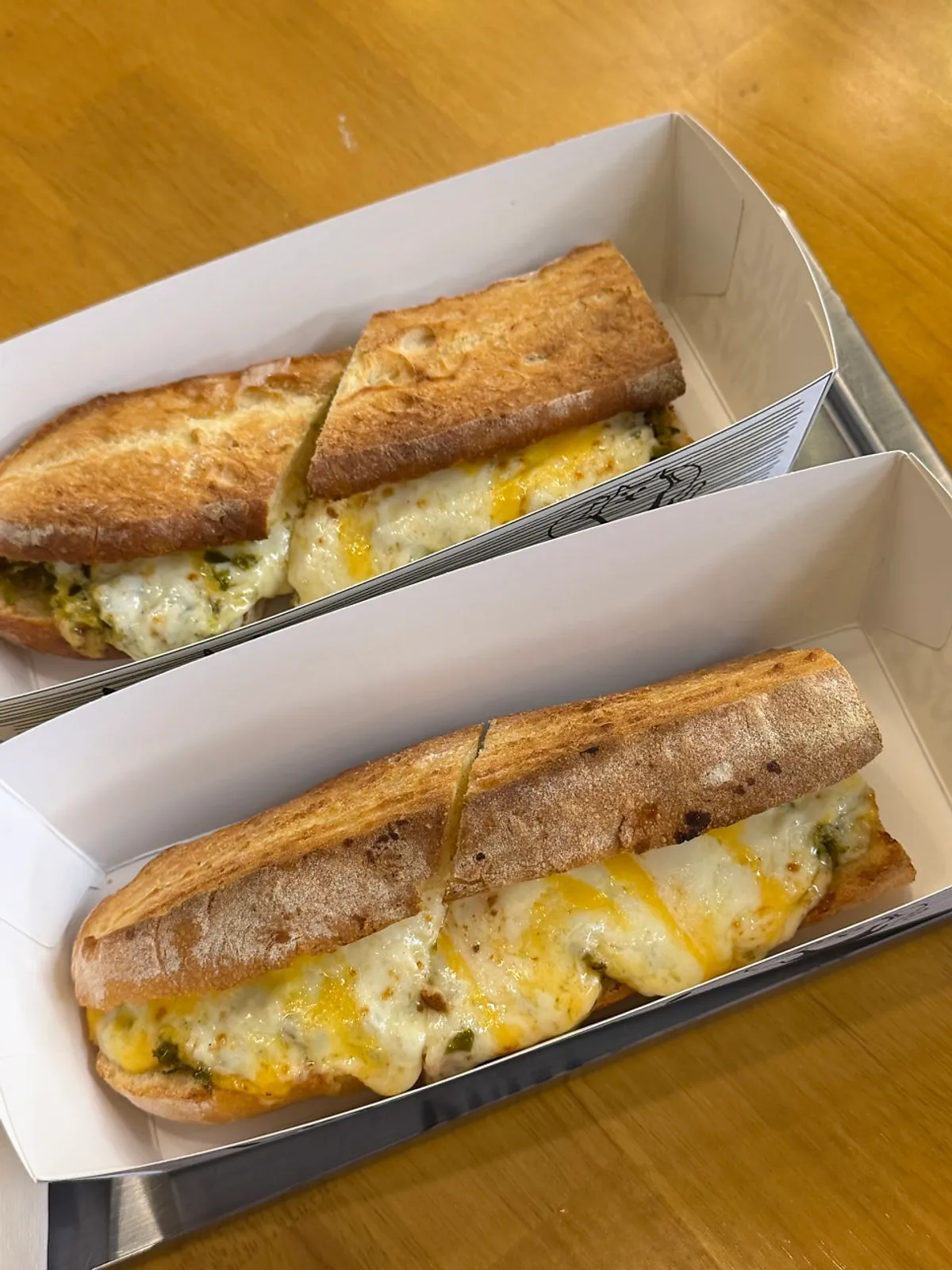 Golden-brown grilled cheese baguette sandwich
