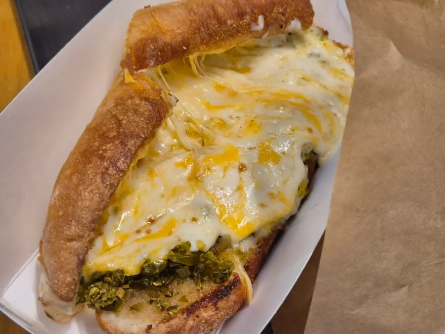 Cross-section of the grilled cheese sandwich packed with three cheeses