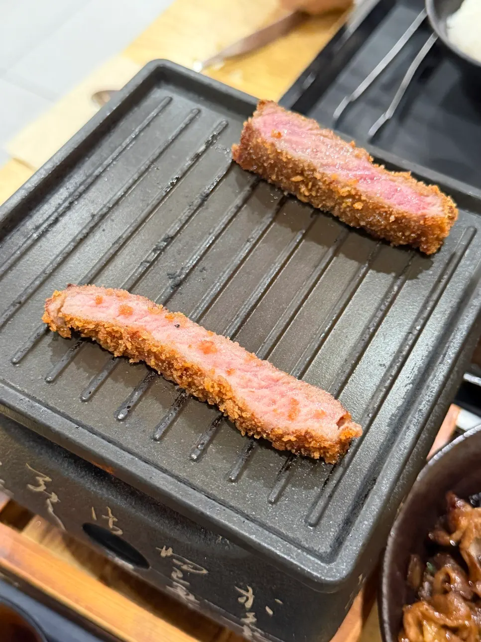 Gyukatsu being grilled on the tabletop griddle