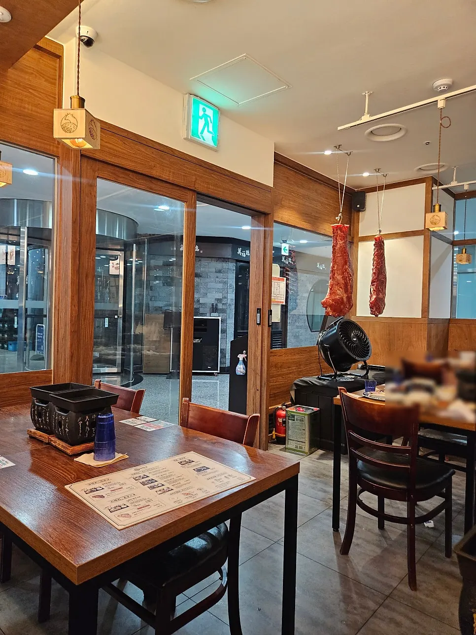 Widely spaced tables at Ichigyu Seoul Station Branch