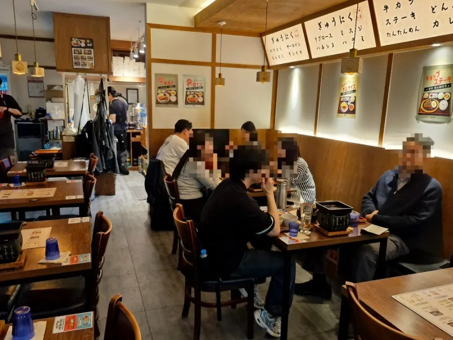 A warmly lit 2-person table seat