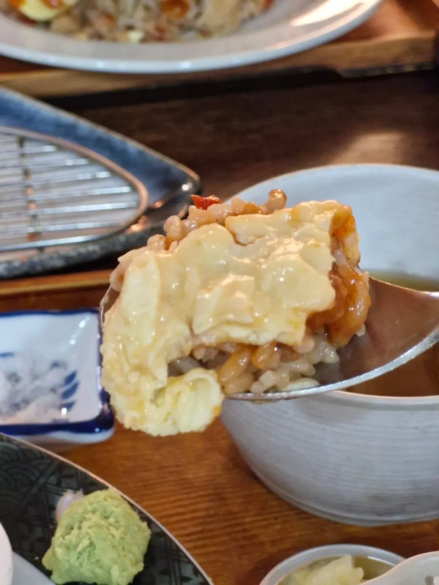 The hamburg steak hidden beneath the egg
