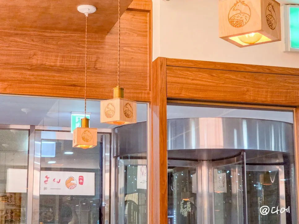 Wood-toned interior of Ichigyu Seoul Station Branch