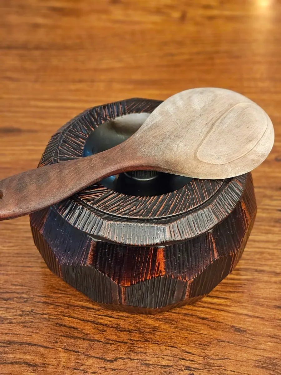Two portions of rice served together in a wooden bowl