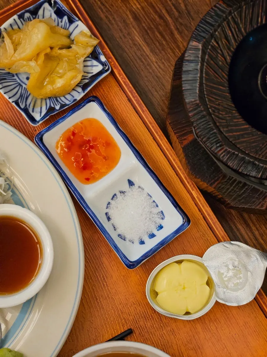 Butter and sauce plate served alongside the meal