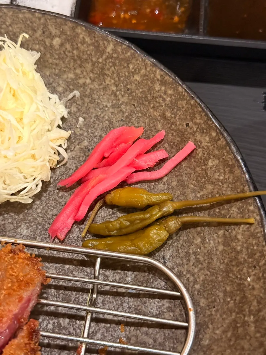 Rice topped with flakes and pickled peppers
