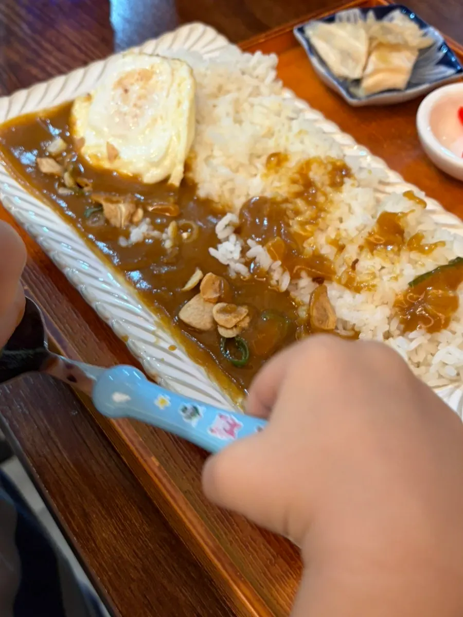 Japanese-style curry topped with garlic chips and fried egg