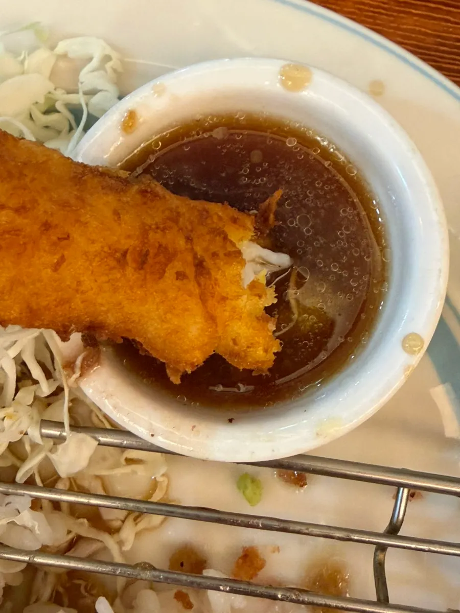 Shrimp tempura on top of the curry