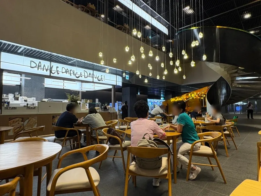 Open, spacious seating inside Dance Dance Dance Seoul Station