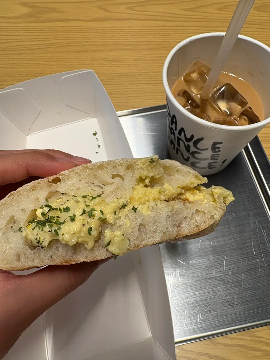 Inside of the ham and egg sandwich with strawberry jam