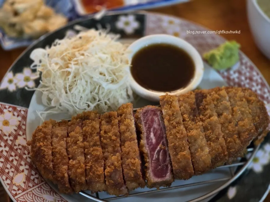 Table spread of gyukatsu and hamburg omurice