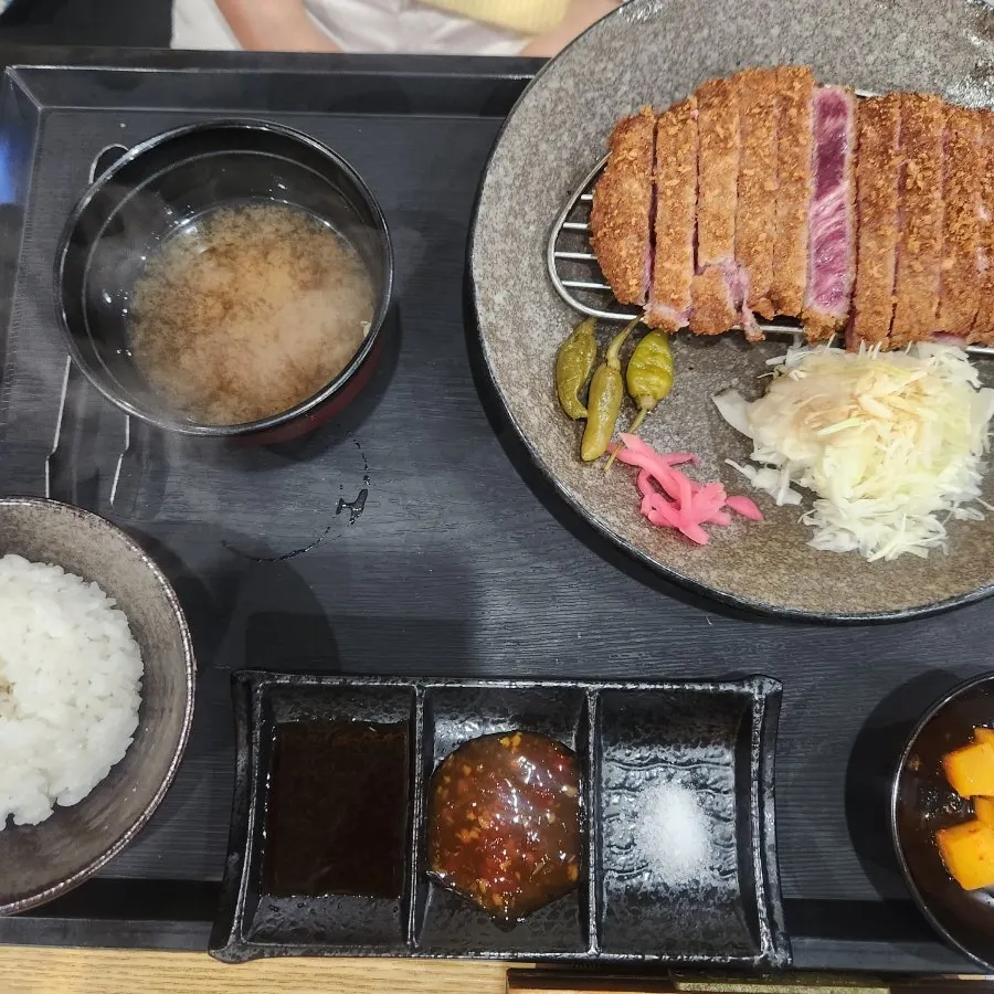 Gyukatsu set meal with rice, soup, and cabbage